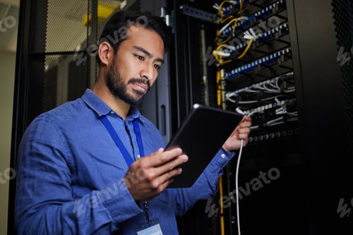 Preview: Server room, tablet and engineer with connection cable for maintenance or software update at night.