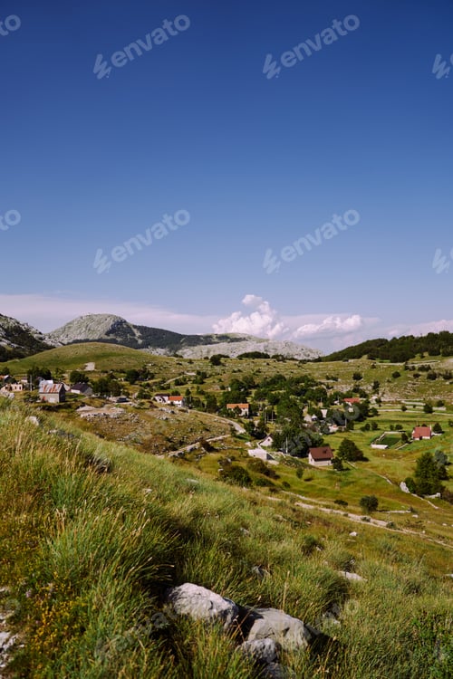 Preview: View of the village in the mountains against the backdrop of greenery