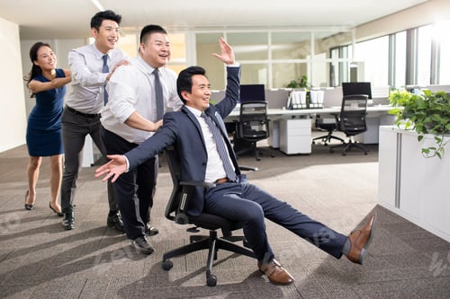 Preview: Chinese business people playing in office