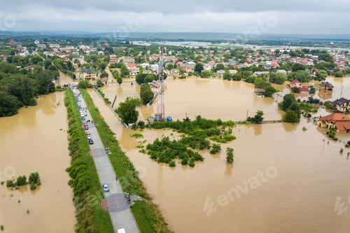 Preview: Aerial view of flooded houses with dirty water of Dnister river in Halych town, western Ukraine