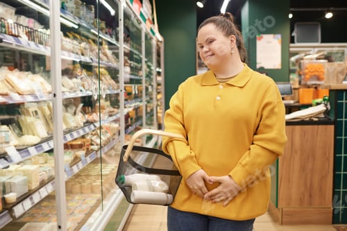Preview: Girl with Down Syndrome Buying Groceries in Supermarket