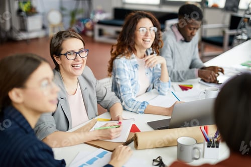 Preview: Smiling Business People at Table