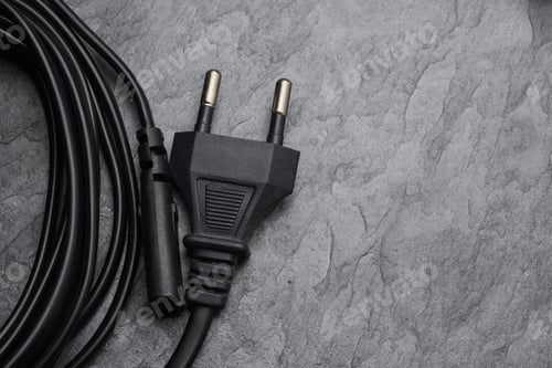 Preview: AC power plug type C on black slate background