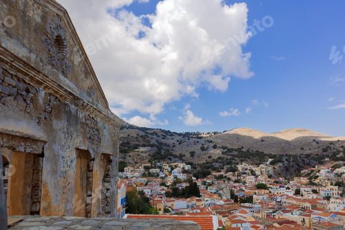 Preview: Panoramic view, aerial skyline of small haven of Symi island. Village with tiny beach and colorful h