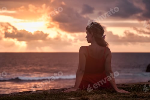 Preview: Middle age woman on tropical coast at sunset background