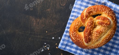Preview: Bavarian pretzels and glass of lager beer. Oktoberfest food menu, traditional salted pretzels over o
