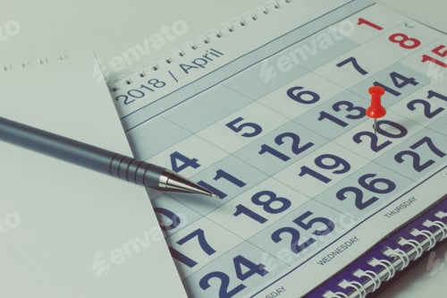 Preview: sheet of a calendar and a pen close-up