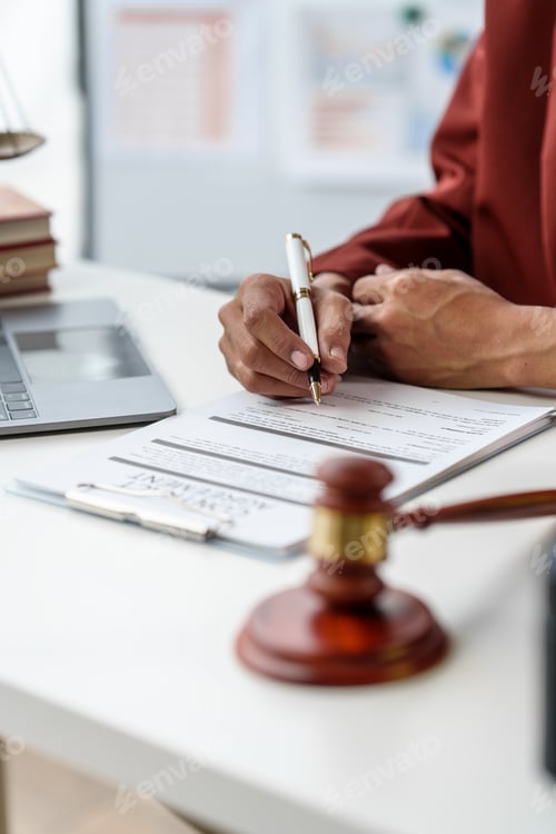 Preview: Business man hands close up working with contract lawyers specialize in dealing with legal issues