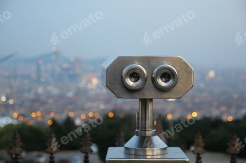 Preview: Coin-operated binoculars looking out over city ,