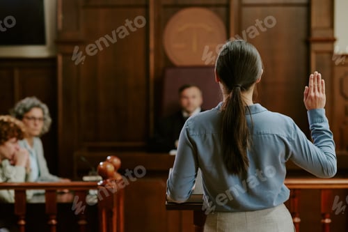 Preview: Young Caucasian Woman Testifying in Courtroom during Legal Proceedings
