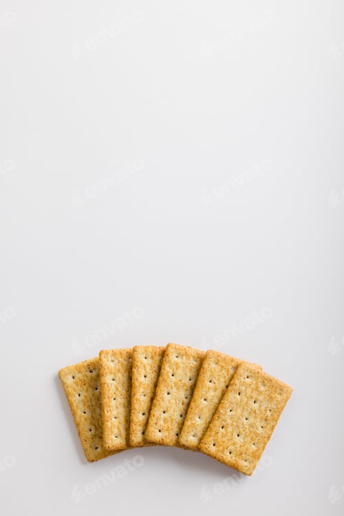 Preview: Overhead view of crackers on white background with copy space