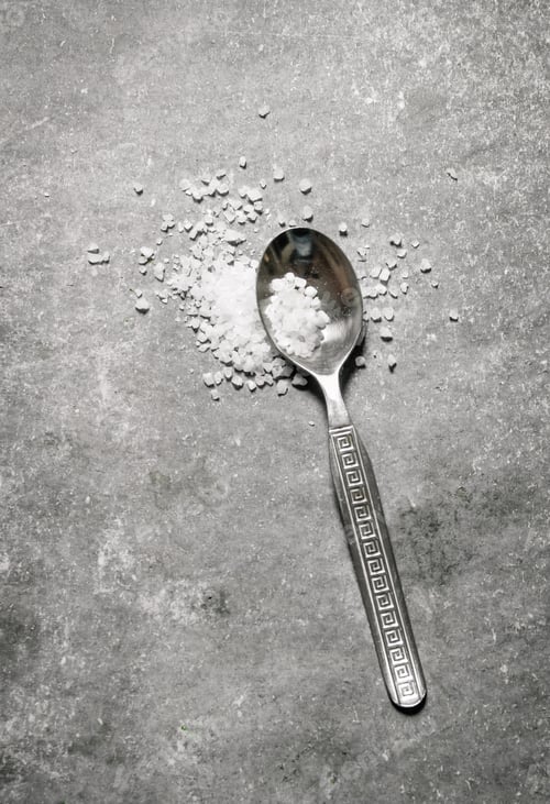 Preview: Spoon coarse salt. On stone background.