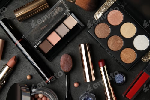 Preview: Flat lay composition with makeup products on black slate table