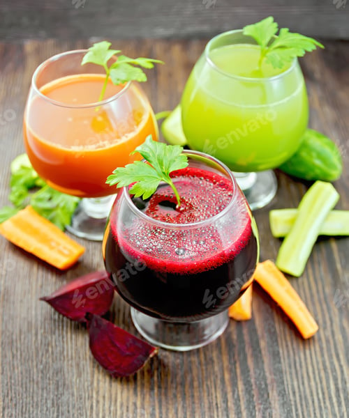 Preview: Juice beet and cucumber in wineglass on dark board