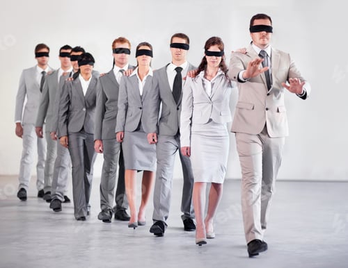 Preview: Shot of a group of blindfolded businesspeople following their equally blind manager