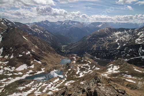 Preview: Scenic view of Tristaina Lakes in Andorra on a cloudy day