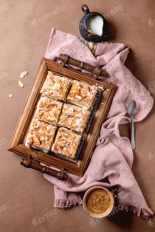 Delicious Almond Cake Slices on Vintage Wooden Tray