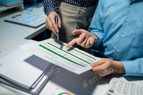 Preview: using computer together in office, successful business people working together in a co-working offic