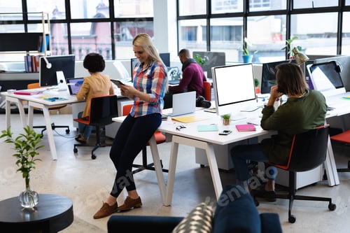 Preview: Caucasian businesswoman working in creative office