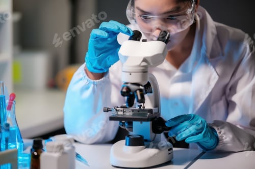 Preview: Asian female scientist looking under microscope, analyzes petri dish sample. specialists working