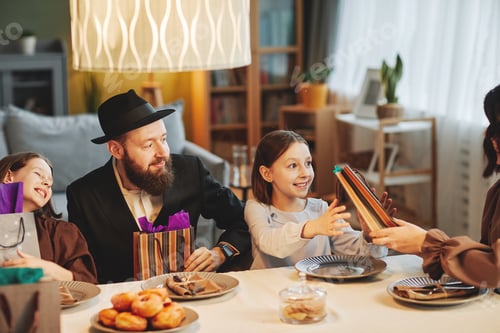 Preview: Jewish Family Sharing Presents at Dinner Table