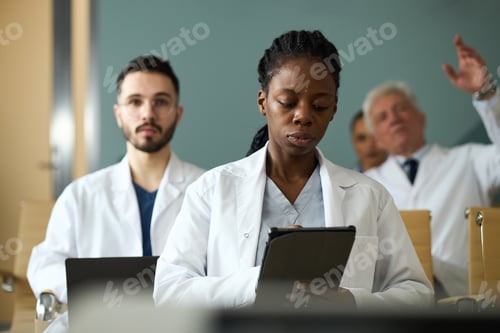 Preview: Portrait of Diverse Medical Team Collaborating in Meeting