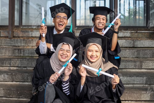 Preview: Group of young diverse students in graduation clothes feeling excited showing diploma