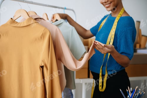 Preview: Young woman running online store Startup small business SME, using smartphone or tablet taking