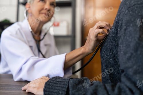 Preview: Doctor listens to heartbeat of patient middle age to check their heart rate
