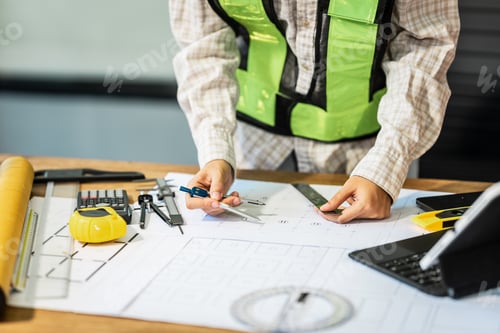 Preview: Female architect engineer is drafting blueprints using CAD software, focusing on sustainable