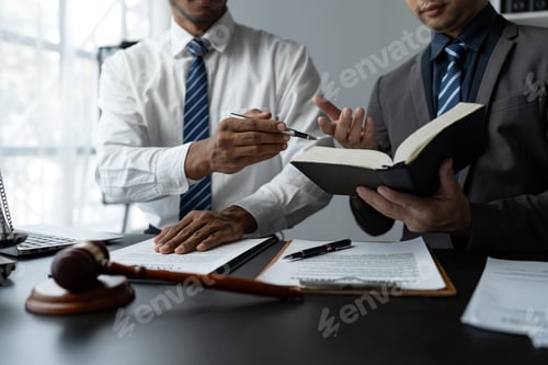 Preview: Businessmen or lawyers working together at a meeting, teamwork and partnerships, discuss documents,