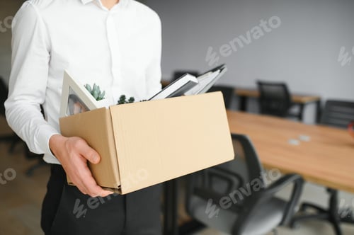 Preview: Man by dismissal. Guy lost job. Fired manager in company. Dismissal box in hands of employee.