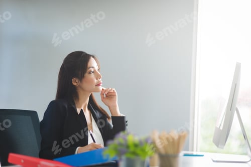 Preview: Business Asian woman working and writing planning on desk in modern office workspace room.