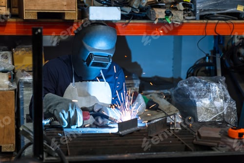 Preview: Engineer technician staff skill worker working metal parts welding in metal machinery workshop