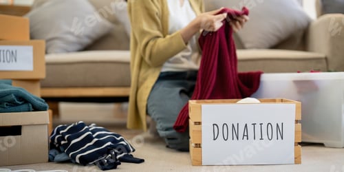 Preview: Donation, asian young woman sitting pack object at home, putting on stuff into donate box with