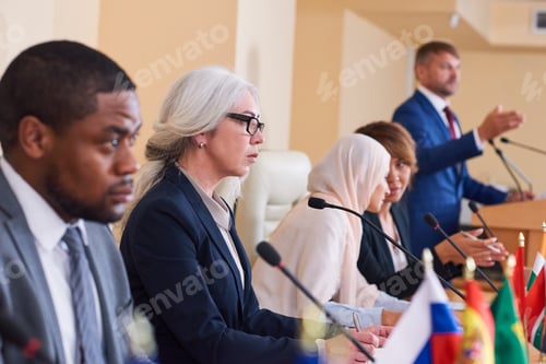 Preview: Confident mature female delegate in formalwear