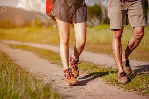 Preview: Young couple asian in a wide field is walking on foot to explore the forest as a holiday activity