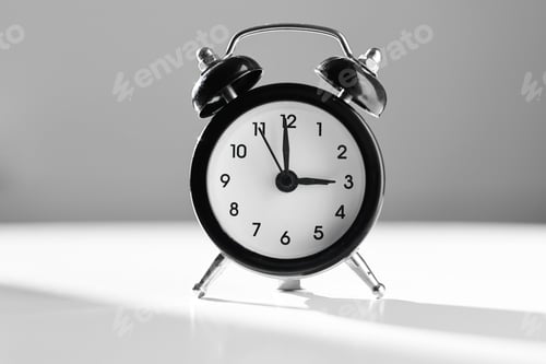 Preview: Modern black and white alarm clock in retro style isolated on white and grey background with shado