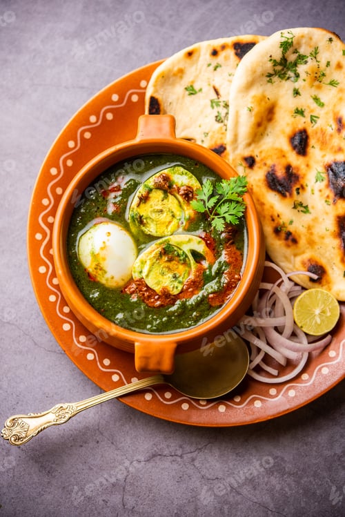 Preview: Spinach egg curry is an Indian non vegetarian dish made using palak gravy with eggs