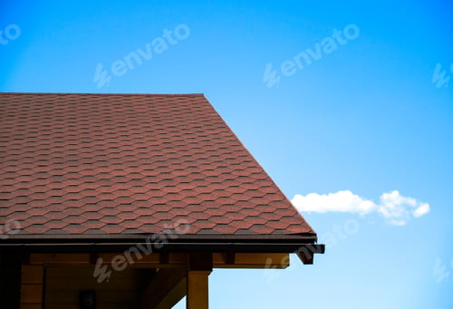 Preview: Tile Building Materials Used For The Roof Of The House. Against The Blue Sky. Coverage From Rain