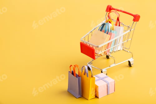 Preview: Trolley cart with colorful paper bags — shopping, sale, supermarket, discount, summer promotion.
