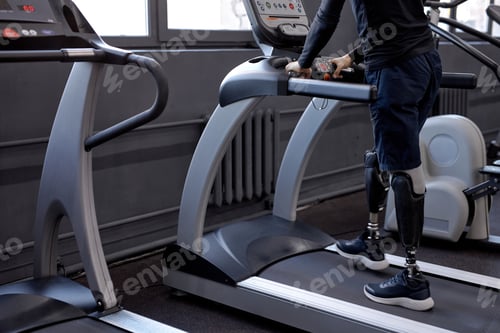 Preview: artificial legs running on treadmill. cropped side view shot