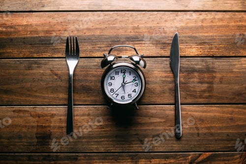 Preview: Cutlery near alarm clock