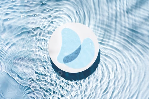 Preview: Eye patches floating on clear water with gentle ripples