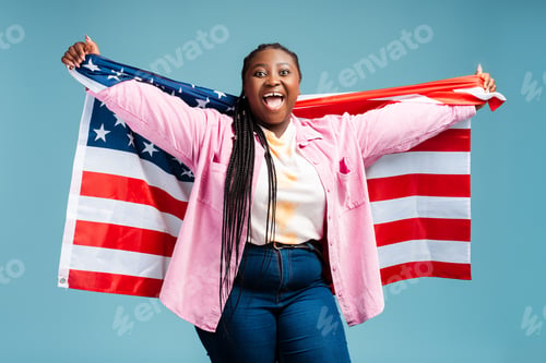 Preview: Happy African American woman holding American flag celebration Independence day. Freedom concept