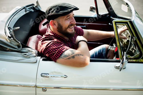 Preview: Man Driving a Car with Windows Down