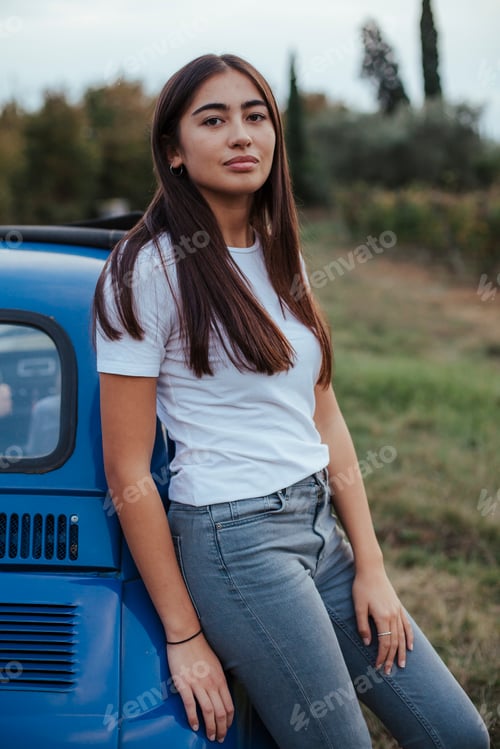 Preview: Portrait of woman leaning against car in countryside, Florence, Toscana, Italy