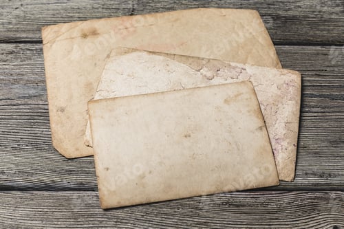 Preview: Old blank papers on wooden table with textured surface for various uses and crafts
