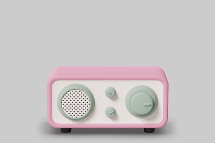 Pink and light green device with speaker and dial.