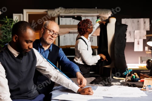 Preview: Tailor working on customer attire
